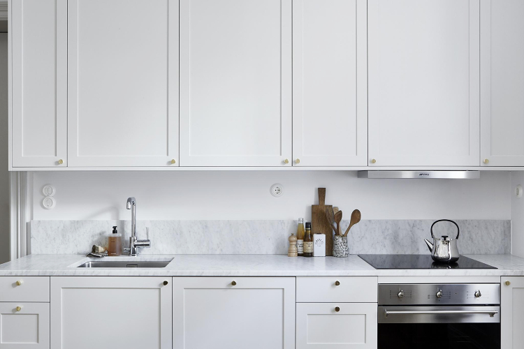 white kitchen with marble