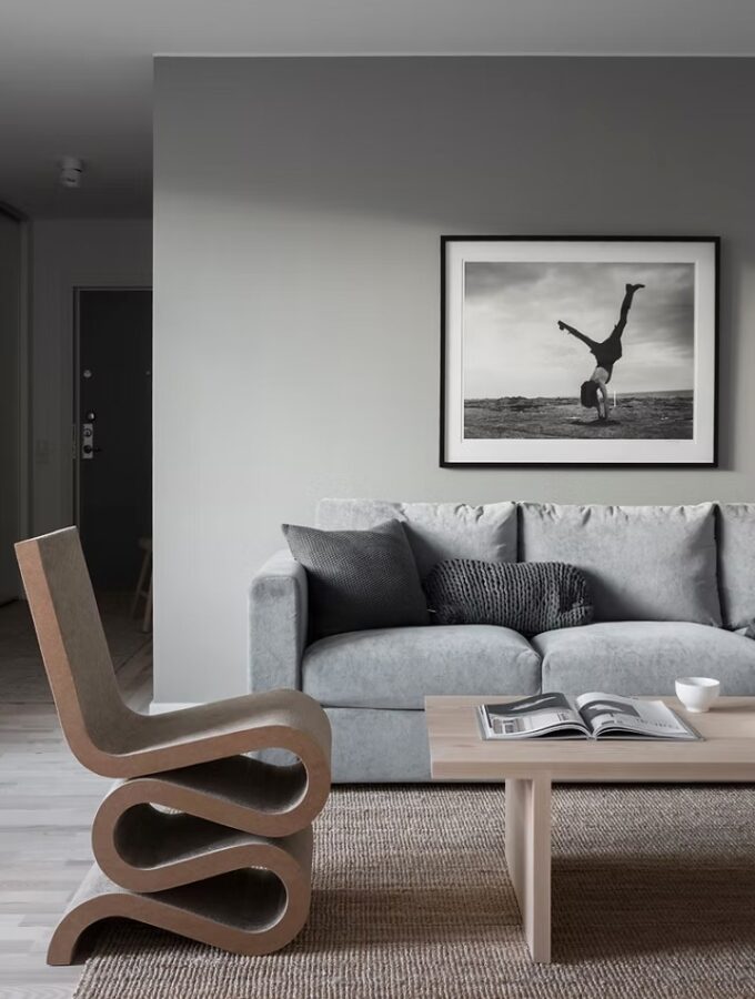 grey living room with statement chair